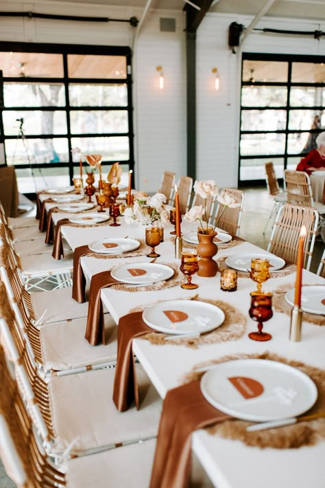 It's a Texas Hill Country Wedding day with terracotta arches, boho pampas grass decor, custom wedding signage and a long sleeve dress. Rusty Rose Wedding Table, Rust Candles Wedding, Boho Wedding Table Set Up, Terracotta Summer Wedding Flowers, Boho Reception Tables, Fall Boho Wedding Reception Decor, Wedding Table Decor Long Tables, Rust Wedding Reception, White And Terracotta Wedding