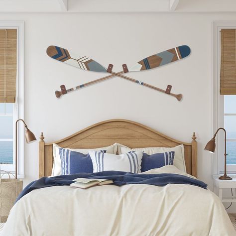 Decorative oars in coastal bedroom. Perfect combination of style and originality. Find our selection of hand painted canoe paddles at: www.ropesandwood.com Oars On Wall Decor, Canoe Paddle Decor, Painted Canoe, Painted Oars, Lakehouse Bedroom, Paddle Decor, Oar Decor, Painted Paddles, Canoe Paddles