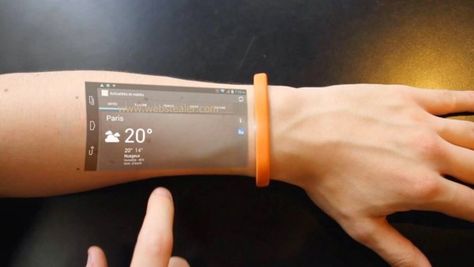 An Android powered smart bracelet forgoes the tiny display of a typical smartwatch and projects a smartphone-size touchscreen onto the skin Saving Private Ryan, Hot Picks, New Inventions, Smart Bracelet, Gadgets And Gizmos, Wearable Tech, Touch Screen Display, Wearable Device, Futuristic Technology