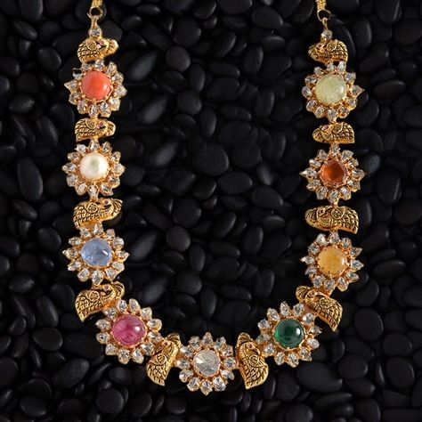 ~ Navratan Haram ~ Nine auspicious stones studded with quality diamonds to make this timeless and gorgeous haram. View this collection at… Navratan Jewellery, Navaratna Necklace, Navaratna Jewellery, Fashion Jewelry Necklaces Gold, Unique Gold Jewelry, Unique Gold Jewelry Designs, Gold Jewelry Designs, Pure Gold Jewellery, Jewelry Necklaces Gold