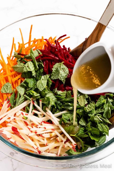 This raw beet salad, loaded with carrots and apples, is a fresh take on coleslaw. The mint and cumin vinaigrette is ridiculously flavorful. This mayo-free side dish is perfect for your summer BBQs and winter dinners alike! #theendlessmeal #salad #beetsalad #rawbeetsalad #sidedish #coleslaw #summersidedish #wintersalad #carrots #glutenfreesidedish #summerrecipes #beets #applerecipe Raw Beet Salad, Best Coleslaw Recipe, Winter Dinners, Ginger Salmon, Winter Veggies, Apple Salad Recipes, Raw Beets, Gluten Free Sides Dishes, Salmon Steak