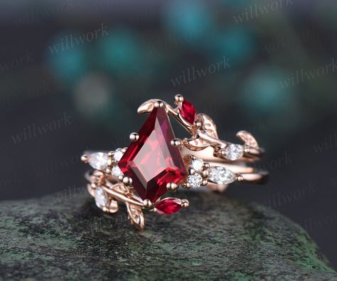 - Metal: Solid gold(10K/14K/18K white/yellow/rose gold),925 sterling silver,platinum available- Main Stone: 7x10mm kite-cut lab ruby- Accent Stone: 1.5mm round and 2x4mm marquise diamonds or moissanites- Wedding Band Stone: lab ruby and diamonds or moissanites- Band Width: 1.3-1.4mm- Can be personalized: Yes Ruby Ring Rose Gold, Gold Ruby Wedding Rings, Red Stone Engagement Rings, Ruby Engagement Ring Gold, Red Engagement Ring, Diamond Enhancer, Ruby Wedding Rings, Topaz Birthstone, Wedding Anniversary Ring