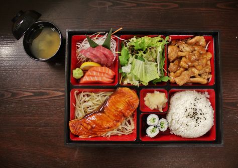 Our bento box - tuna + salmon sashimi, chicken teriyaki, salmon teriyaki - served with rice, sushi, salad + miso soup #japanese Soup Japanese, Salmon Grilled, Salmon Teriyaki, Sushi Salad, Rice Sushi, Japanese Bar, Salmon Sashimi, Chicken Teriyaki, Delivery Menu