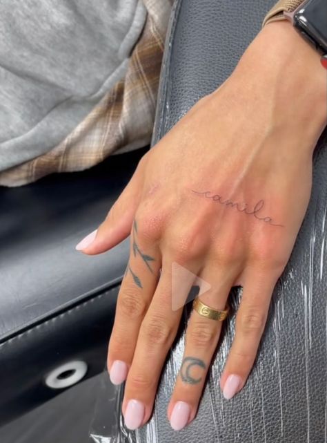 Dainty Feminine Tattoos Hand, Hand Cursive Tattoo, Tattoo Writing On Hand, Name Tattoos On Hand For Women, Script Hand Tattoos For Women, Cursive Hand Tattoos For Women, Virgo Word Tattoo, Cursive Name Tattoo On Wrist, Names On Hand Tattoos