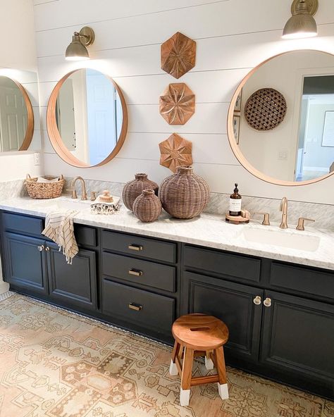 Light wood round bathroom mirrors lit by brass sconces are mounted to a white shiplap wall. A black double sink bathroom vanity with white and gray marble countertop stands under the mirrors. Boho Vanity Bathroom, Second Bathroom, Bathroom 2024, Sophisticated Bathroom, Girls Bathroom, Bathroom Colors, Bathroom Remodel Master, Bath Tub, Dream Decor