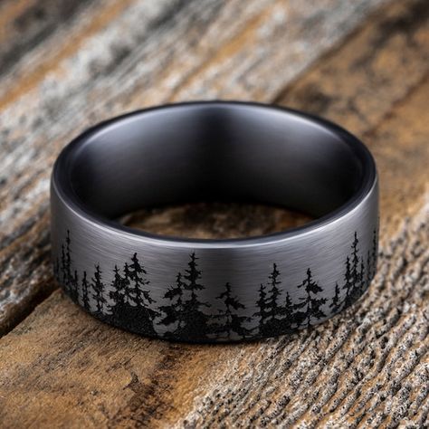 A striking forest-inspired motif rings the circumference of this handsome men's wedding band. Fashioned in tantalum, the inside of the ring is lined with smooth black tantalum to complete the look. The band features Comfort-Fit, which gives a narrower feel than it's actual width when worn. Comfort-Fit rings are designed to have a slightly rounded inside surface so less of the metal touches your finger, which enhances the feel of the ring while wearing and sliding it on and off your finger. Groom Wedding Band, Western Wedding Rings, Nature Wedding Ring, Antler Wedding Band, Stainless Steel Wedding Ring, Mens Wedding Bands Tungsten, Tungsten Wedding Rings, Titanium Wedding Band, Jared The Galleria Of Jewelry