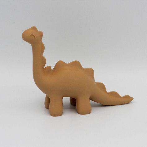 Add prehistoric charm to your space with our adorable dinosaur figurine. This charming desk or decoration piece features a delightful design, bringing a touch of whimsy to any room. Crafted with attention to detail, it's a perfect addition for dino enthusiasts and a conversation starter for all. Get transported back in time.  Features: 1️⃣ Adds a perfect flair to any dinosaur lovers desk, home or office. 2️⃣ Made using 100% renewable energy in Beaverton, Oregon. 3️⃣ Compact size: fits any displa Simple Ceramic Sculpture, Cute Clay Dinosaur, Diy Clay Dinosaur, Air Dry Clay Dinosaur, Dinosaur Ceramics, Dinosaur Pottery, Clay Dino, Clay Dinosaur, Ceramic Dinosaur