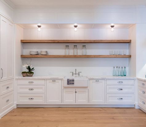 Framed Inset Cabinets with Floating Open Shelves. The laundry room features framed inset cabinets, white oak hardwood flooring and floating open shelves above a farmhouse sink. Countertop is carrara marble. Sleek cabinets Framed Inset Cabinets with Floating Open Shelves. Framed Inset Cabinets with Floating Open Shelves #FramedInsetCabinets #FloatingOpenShelve #OpenShelves #FloatingShelves Haefele Design Kitchen Open Shelving Above Sink, Shelves Above Sink, Duplex Renovation, Above Kitchen Sink, Floating Kitchen Shelves, Backsplash For White Cabinets, Glass Shelves Decor, Kitchen Floating Shelves, Glass Shelves Kitchen