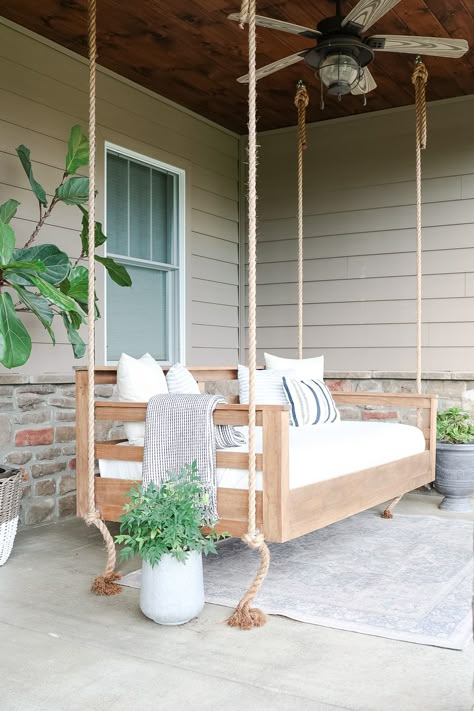 Make your outdoor space extra relaxing with a porch swing bed. Let me show you how to build a porch swing bed with this easy tutorial. Porch Hanging Chairs, Pergolas With Swings, Front Porch Swings Ideas, Build Outdoor Daybed, Porches With Swings, Diy Hanging Day Bed Porch Swings, Day Bed Swings Outdoor, Day Bed Swings, Outdoor Swinging Daybed