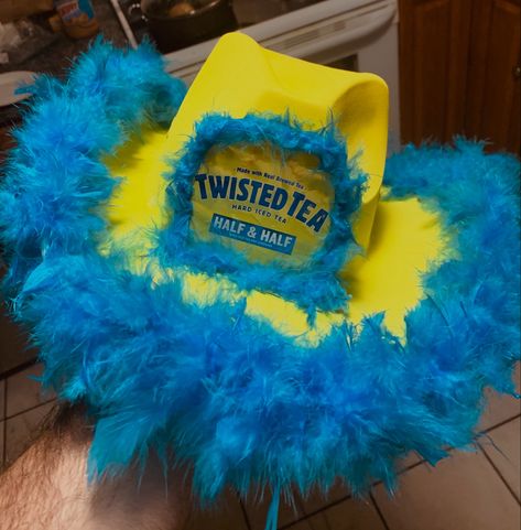 Yellow Hat, Blue Boa, Twisted Tea Can Drink Themed Cowboy Hat, Diy Cowboy Hats Alcohol, Cowgirl Liquor Hats, Cowboy Hat Drinks, Alcoholic Drink Cowboy Hats, Twisted Tea Cowboy Hat, Drink Cowgirl Hats, Diy Alcohol Hats, Alcohol Themed Costumes