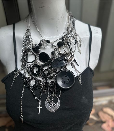 🔍˚₊· ͟͟͞͞➳❥ The Maynia Necklace 🧷 🔎📓 dropping 10/18 only on novisade.com {link in bio} This upcycled silver layered necklace is the ultimate maximalist piece for anyone who is a regular at the local industrial goth club! 🦇 Featuring recycled chains, beads, spikes, crosses, hand collages cameo, buttons, soda tabs, buckles n more! Also a sterling silver Egyptian goddess ‘Isis’ ! She’s adjustable, nickel free and OSFM! 🏷️/keywords: #upcycled #handmadejewelry #festivaljewelry #ravejewelry #g... Punk Handmade Necklace For Alternative Fashion, Alt Layered Necklaces, Goth Chain Necklace, Gothic Layered Necklace, Goth Necklaces Layered, Industrial Goth, Rave Jewelry, Goth Club, Soda Tabs