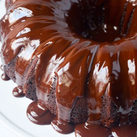 If you are looking for a rich chocolate cake that is easy to make and tastes amazing, look no further!  This decadent Chocolate Bundt "Lava" Cake is for you.  While lava cakes usually contain a warm chocolate center, this bundt cake has it on the outside.  Shiny, flowy, chocolate ganache is the perfect topping for this dark, moist chocolate cake.  I guarantee it will be one of the best chocolate cakes you will have ever tried. Easy Chocolate Bundt Cake, Milky Way Cake, The Girl Who Ate Everything, Lava Cake Recipes, Chocolate Bundt, Disney Recipes, Chocolate Bundt Cake, Chocolate Lava, Lava Cake