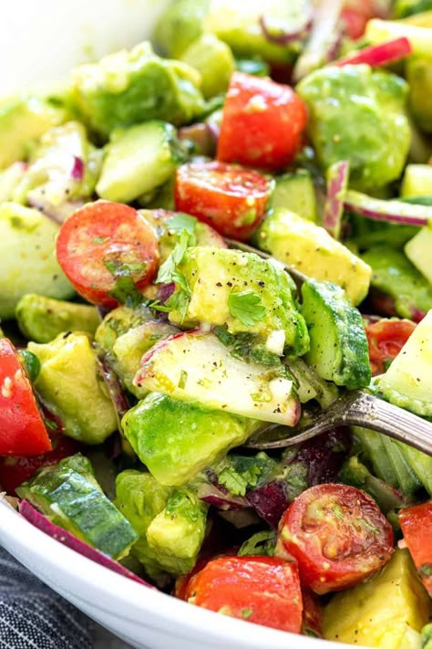 Cucumber tomato avocado salad recipe with cilantro lime dressing. A healthy side dish in just 30 minutes that pairs nicely with bbq foods. Recipe With Cilantro, Salad With Cilantro Lime Dressing, Tomato And Avocado Salad, Cucumber Tomato Avocado Salad, Cilantro Salad, Cilantro Recipes, Green Salads, Bbq Salads, Cilantro Lime Dressing