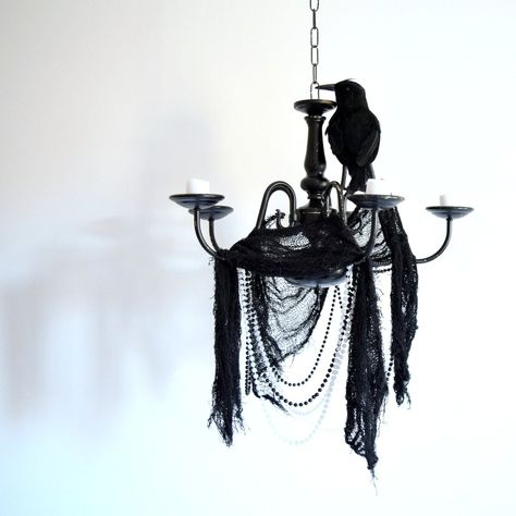 How to make a Halloween chandelier decoration using an old broken thrift store chandelier, spray paint and some dollar store decorations. Diy Halloween Chandelier, Halloween Chandelier Decor, Diy Baby Gym, Halloween Chandelier, Chandelier Decorations, Casa Halloween, Halloween Party Dinner, Halloween Crafts Decorations, Diy Chandelier