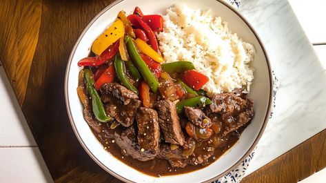 This Crockpot pepper steak recipe delivers tender beef strips and colorful bell peppers simmered in a savory, slightly sweet sauce. The slow cooker brings out incredible flavors, making it the perfect easy dinner for busy nights. Try this recipe today – see full instructions #crockpotrecipes #peppersteak #beefrecipes #easymeals #slowcooker #comfortfood #weeknightdinner #asianinspired #slowcooked Bottom Round Steak Recipes, Crockpot Steak Recipes, Crockpot Pepper Steak, Round Steak Recipes, Crockpot Stuffed Peppers, Crockpot Steak, Pepper Steak Recipe, Slow Cooker Stuffed Peppers, Beef Strips