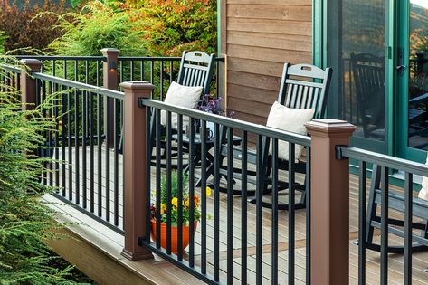 11 Front Porch Railing Ideas to Add Curb Appeal Wrought Iron Railing Exterior Front Porch, Front Porch Spindles Railing Ideas, Front Porch Post And Railing Ideas, Craftsman Style Porch Railing, Front Porch Railings Ideas, Porch Banister Ideas, Front Porch Railing Ideas Farmhouse, Porch Without Railing, Modern Porch Railing