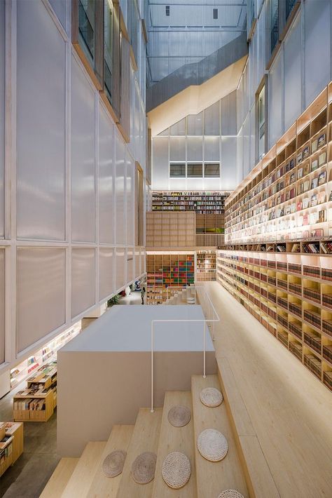 "We embedded a bookstore into the space of two atriums. It links up the 1F and 2F floors through different levels of stairs, hence forming a vertical circulation route to walk around and explore between both atriums while creating rich, playful visual effects and experiences within the limited space."

Learn more at Architonic.com

#architonic #architecture #design #interior #interiordesign #bookstore #bookstoreinterior #shopinterior #interiorlover Flexible Space, Architecture Concept Drawings, Folder Design, Interior Stairs, Library Design, Space Architecture, Structure Design, Shop Interiors, Restaurant Interior