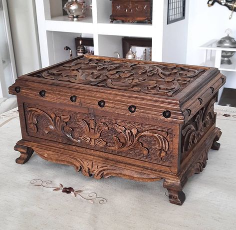 This amazing jewelry wooden box with lock is carved from walnut tree. Inside the jewelry box, bottom is covered by a claret velvet. At the rear corner, there is a hidden key pocket with camouflaged lid. It is totally a wood artwork for your pleasure. DIMENSIONS: Width 12.6 inches (32 cm) Depth 9 inches (23 cm) Height 6.1 inches (15.5) Inner Dimensions: 10.2x7x3.5 inches (26x17x9 cm) (The volume inside the lid is not included) Please visit our store to see all alternatives that you would like👇 h Jewerly Boxes Diy Wooden, Cool Wooden Boxes, Hidden Jewelry Boxes, Antique Jewelry Box Wood, Wooden Treasure Chest, Jewelry Box Wood, Engraved Jewelry Box, Custom Wooden Boxes, Jewelry Box With Lock