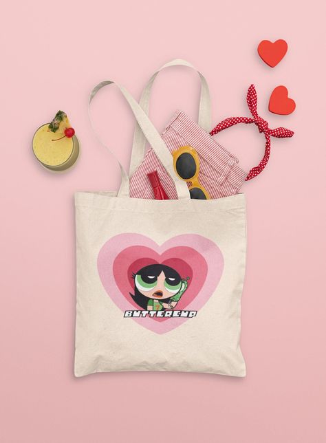 Y2K Powerpuff Girls Tote Bag in a vintage design. Perfect for carrying your essentials in style. 

100% cotton. 15.75"W x 12.5"H x. #y2kfonts #canvafree #retrodesign #vintagefonts #digitalart Y2k Powerpuff, Aesthetic Powerpuff, Y2k Style Aesthetic, Powerpuff Girls Buttercup, Totes Ideas, Heart Tote Bag, Picnic Beach, Girls Tote, Trendy Tote Bags