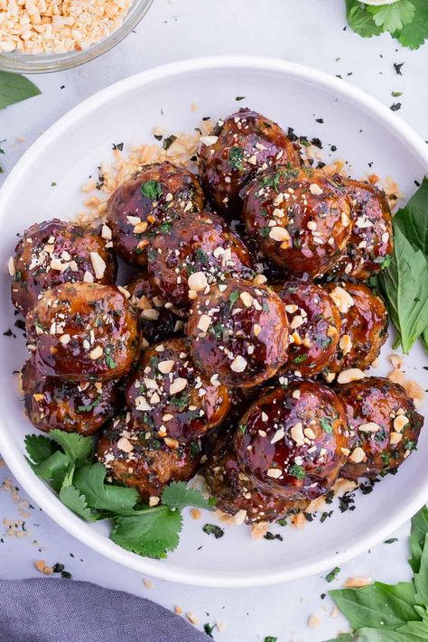 A sticky sweet teriyaki sauce coats tender Thai Chicken Meatballs that are bursting with fresh herb and Asian flavors in this easy recipe! Thai Chicken Meatballs, Thai Meatballs, Air Fryer Brussels Sprouts, Chicken Meatballs Recipe, Sweet Teriyaki Sauce, Peanut Salad, Chili Garlic Paste, Easy Quinoa, Chicken Meatball Recipes