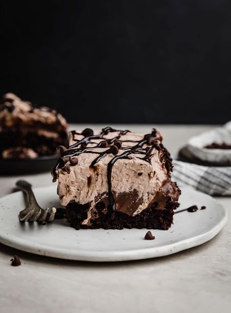 This chocolate poke cake is a chocolate lover's DREAM. Fudgy chocolate cake is filled and topped with rich chocolate pudding, then finished off with a fluffy chocolate whipped cream. Oh, and it's all made from scratch, so it tastes incredible. The cake is made in just one bowl and the pudding comes together in minutes. You don't want to miss this cake! Fudgy Chocolate Cake, Punch Bowl Cake, Pudding Poke Cake, Chocolate Poke Cake, Chocolate Whipped Cream, Sweet Treats Desserts, Poke Cake Recipes, Healthy Ice Cream, Poke Cake