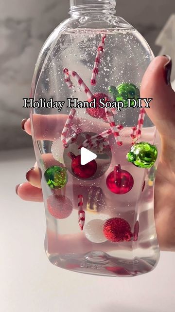 Ivette Kettel | Home Decorator on Instagram: "This DIY holiday soap dispenser is so easy and adds the cutest touch of Christmas cheer! All you need is clear hand soap and tiny ornaments. Just pop them in, and you’re ready to impress your guests! I did a Halloween version, and it was a hit, so had to bring it back for Christmas. Have you tried anything like this? Let me know if you give it a go!
Comment SHOP below to receive a DM with the link to shop this post on my LTK ⬇ https://liketk.it/4WfHR #ltkholiday #ltkvideo #ltkseasonal
.
.
.
.

HolidayDIY #GuestBathroomDecor #EasyChristmasIdeas #holidaydiy #christmasdecor #holidaydecor #christmasdiy #tinyornaments" Christmas Bathroom Decor Diy, Christmas Jar Crafts, Christmas Jars Diy, Hand Soap Gift Ideas, Bathroom Christmas Decor Ideas, Christmas Soap Dispenser, Tiny Ornaments, Diy Hand Soap, Candy Gifts Diy