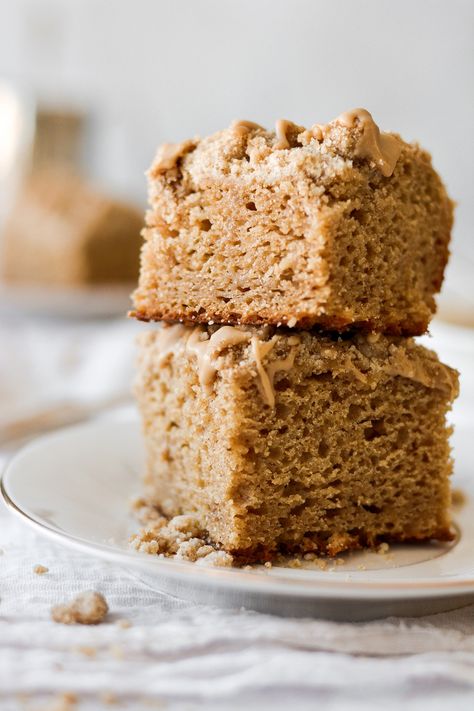 This gingerbread coffee cake is spiced with cinnamon, ginger, nutmeg and cloves, with hints of brown sugar and molasses. A crumbly topping adds crunch, and a drizzle of sweet maple icing is the perfect finish. This easy coffee cake makes a wonderful breakfast for the holidays. You can make it on Christmas Eve, and enjoy it Christmas morning without needing to get up early to make breakfast! A high altitude tested recipe. Christmas Morning Coffee Cake, Gingerbread Coffee Cake, Healthier Coffee Cake, Gingerbread Coffee Cake Recipes, Moist Gingerbread Cake, Gingerbread Cake With Cinnamon Molasses Frosting, Spiced Gingerbread Loaf, Christmas Coffee Cake, Gingerbread Cake Recipe