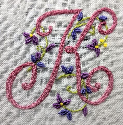 2 May 2020: The letter F is finished....... 15 to go! Dusty pinks fading from top to bottom & little purple flowers. Height 2.5 inches/6.5 cm.  Cotton thread on linen.  Thanks to Mary Corbet's Monogram patterns.  #GF20 #HandEmbroidered #K #Alphabet #GF20 #embroideryart #embroidery K Letter Embroidery Design, K Embroidery Letter, K Alphabet, Hand Embroidery Letters, Embroidered Alphabet, The Letter F, Basic Hand Embroidery Stitches, Embroidered Letters, Embroidery Alphabet