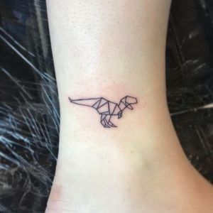 Animal Tattoos and their Meanings | by Jhaiho | Medium T Rex Tattoo, Origami Dinosaur, Dinosaur Origami, Tatuaje Trash Polka, Minimalist Tattoo Meaning, Dinosaur Tattoo, Origami Tattoo, Dinosaur Tattoos, Men Tattoos