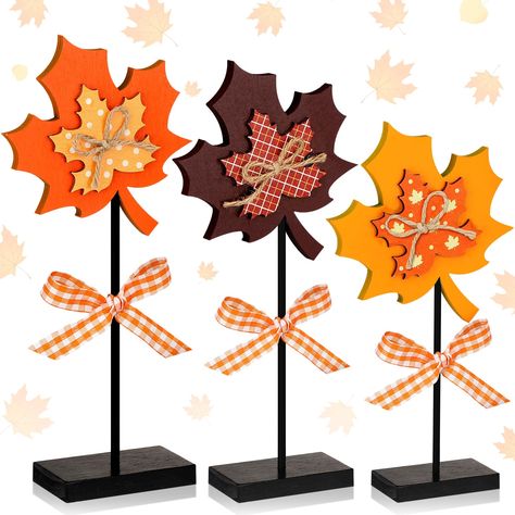 PRICES MAY VARY. Adequate Quantity and Classic Styles: you will receive 3 pieces of autumn maple leave wooden sign in 3 different styles, single sided printed, simple and elegant, rich in quantity, diverse in styles, which can satisfy your daily life or Thanksgiving decoration needs in autumn Bright and Reliable: the maple leave standing wood block is made of smooth and sturdy wood material with quality spray paint, making them hard to fade or break, solid and thick, providing you with longer us Fall Harvest Decor, Wooden Leaf Crafts, Thanksgiving Wood Signs Fall Crafts, Wooden Fall Crafts Overstock, Wood Block Art Thanksgiving, Wooden Maple Leaf, Thanksgiving Wood Signs Overstock, Thanksgiving Wood Crafts, Fall Blocks