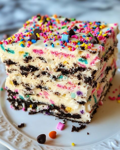 No-Bake Funfetti Oreo Icebox Cake Ingredients: For the Cake: 1 package (14.3 oz) Oreo cookies (regular or golden) 2 cups heavy cream 1 cup powdered sugar 1 tsp vanilla extract ½ cup Funfetti sprinkles For the Filling: 8 oz cream cheese, softened 1 cup granulated sugar 1 tsp vanilla extract 1 cup mini marshmallows (optional, for extra texture) 1 cup mini chocolate chips (optional, for added crunch) For Garnish (optional): Additional Funfetti sprinkles Crushed Oreo cookies Whipped cream In... Funfetti Oreo, Funfetti Sprinkles, Oreo Icebox Cake, Crushed Oreo, Random Aesthetics, Icebox Cake, Mini Marshmallows, Mini Chocolate Chips, Oreo Cookies