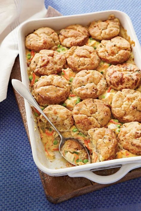 Chicken Pot Pie with Bacon-and-Cheddar Biscuits | The bacon-studded, cheesy biscuit topping is the coup de grace of this particular pot pie. The crowd-feeding, crowd-pleasing 9x13 casserole is one of our signature weeknight dishes. #casserole #recipes #thanksgiving #southernliving Easy Sunday Dinner, Sunday Dinner Ideas, Chicken Pot Pies, Sunday Dinner Recipes, Cheddar Biscuits, One Dish Dinners, Chicken Pie, Pot Pies, Bacon Cheddar