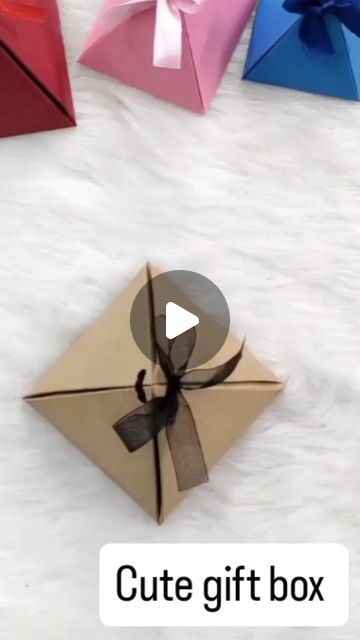 Diy & craft on Instagram: "Amazing cute gift box 🎁🎁🎁🎁

#diy #diycrafts #papercrafts #paperflowers #diyideas #surprise #paper #love #cardmaking #grif #surprise #reels #instagram #explore #instagram #instagramreels #ideas #surprisebox #homemade #homemade #day #viralsong #flowers #butterfly #beautiful #diyprojects #diyideas #paperbox #weddinggift" Brown Packing Paper Crafts, Brown Paper Packages Diy, Cheap Brown Box Bag For Gifts, Brown Square Box Bag Gift, Kraft Box Christmas Packaging, Viral Song, Gift Wrapping Techniques, Surprise Box, Cute Gift Boxes