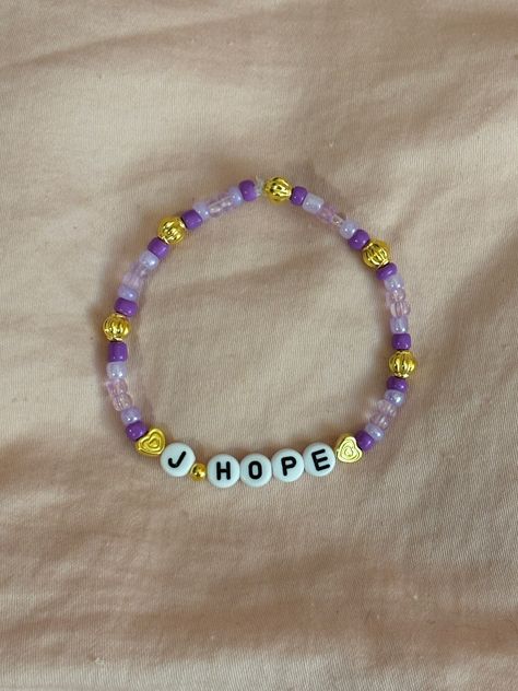 A hand-crafted glass bead friendship bracelet to celebrate J-Hope of BTS! A cute concert accessory or a cute way to show off your favorite bias!  This bracelet is made with Czech glass beads, plastic letter beads, plastic spacer beads, and is on an elastic thread measured at about 10 inches in length for a relaxed/loose fit. If you would like the bracelet you order to be smaller or larger, please leave the requested size in inches in the personalization box!  All bracelets are made to order and are typically shipped out within 1-3 business days unless otherwise stated. Bead Friendship Bracelet, Bts Bracelet, Hope Bracelet, Beaded Braclets, Plastic Letters, Friendship Bracelets With Beads, Elastic Thread, Bracelet Ideas, Letter Beads