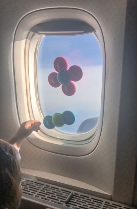 Kids Travel Must Have - suction toys for the airplane. These suction cup spinners go on the airplane window and keep my daughter busy for a long time. Great for a baby and even a bigger kid. Baby Packing List, Yoyo Stroller, Traveling With A Baby, Babyzen Yoyo, Pink Duffle Bag, Flying With A Baby, Mom Needs, Airplane Window, Kids Nursery Rhymes