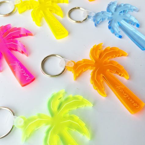 "Headed to a beach bachelorette? Throwing a tropical party? Looking for something special to personalize your gifts? Snag these personalized palm tree keychains as the perfect addition to your party or bachelorette gifts.  It's a great way to personalize your bags, add a little something to a gift, or keep it for yourself! || THE DETAILS || -Size: size is APPROXIMATELY 2in wide x 2.5in tall. Size will vary with different letters -1/4 inch thick durable neon/fluorescent acrylic || HOW TO ORDER || or refer to the \"How to Order\" photo in listing 1. choose your quantity from the drop down menu with a red asterisk 2. choose whether you want just a palm tree or palm tree with names - In the personalization section - 3. Enter name if you purchased palm tree with name **all names will be lowerca Palm Tree Bachelorette Party, Palm Springs Bachelorette Gift Bags, Tropical Bridesmaid Proposal, Cancun Bachelorette Party Theme, Bachelorette Gift Bags Beach, Bach Gift Bags, Luau Bachelorette Party, Hawaii Bachelorette Party, Key West Bachelorette Party