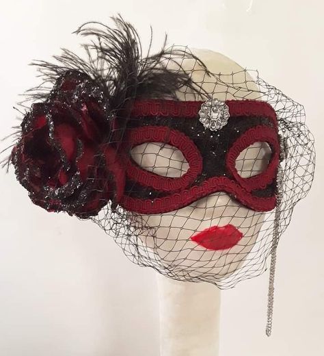 Red Black Masquerade Mask, Ballroom, Steampunk Mask, Handmade, Costume, Accessory Steampunk red and black masquerade mask. This handmade one of a kind mask is made from a paper mache base. Mask has been covered with faux leather look black fabric which is then embellished with black glitter for shimmer. Mask is edged with red gimp around the edges and eyelets. I have applied a large red rose flower which is embellished with black glitter to right side of mask, tucked behind mask you will find sp