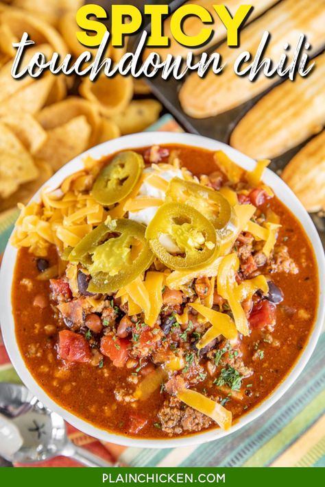 Slow Cooker Spicy Touchdown Chili - our go-to chili recipe! Super simple to make and tastes great! Ground beef, pork sausage, bacon, chili beans, black beans, Rotel diced tomatoes and green chiles, beef broth or beer, onion, chili powder, cumin, garlic, basil, and cayenne slow cook all day in the crockpot. It has a kick! Use mild Rotel if you are sensitive to heat. Makes a ton - great for a crowd! Serve with cornbread for an easy potluck meal! Sausage Chili Recipe Crock Pot, Crazy Chili Recipe, Sausage Chili Crockpot, Chili With Ground Beef And Sausage, Smoked Sausage Chili Recipes, Touchdown Chili Recipe, Ground Beef And Sausage Chili, Touchdown Chili, Steak And Potato Soup