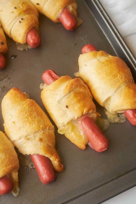 Looking for a fun and easy way to make hot dogs? Crescent Roll Hot Dogs are the perfect appetizer for your next party, or as the main course for a quick and easy meal! All you need is a package of crescent rolls, some hot dogs, and cheese. Make them extra special with a little... Read More Crescent Roll Hot Dogs © You Say Potatoes. Croissant Hot Dogs, Weiner Wraps Crescent Rolls, Crescent Hot Dogs, Crescent Roll Hot Dogs, Cressant Rolls, Cheese Crescent Roll Recipes, Hot Dog Crescent Rolls, Making Hot Dogs, Mini Hot Dogs