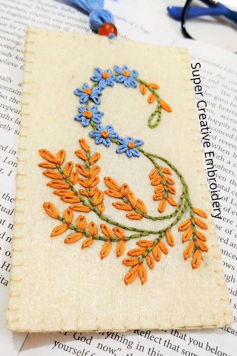 In this video tutorial, we'll walk you through the complete process of making an Embroidered Bookmark (Letters 'S' Monogram Bookmark). You can download this free embroidery pattern by clicking on the link provided in the description of the video. Hand Embroidery Bookmark Pattern, S Letter Embroidery Designs, Embroidered Bookmarks Hand Embroidery, Felt Embroidered Bookmarks Diy, Cute Diys To Sell, Diy Embroidery Bookmark, Bookmark Embroidery Patterns, Diy Embroidered Bookmark, Hand Embroidered Bookmark