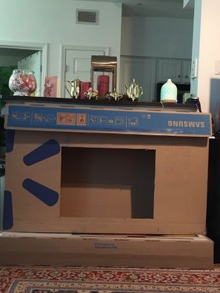 Diy Fireplace From Cardboard, Diy Fireplace For Classroom, Diy Christmas Fireplace Cardboard Easy, How To Make A Cardboard Fireplace, Renter Friendly Faux Fireplace, Faux Fireplace Diy Cardboard Christmas, How To Make A Fireplace Out Of Boxes, Diy Cardboard Fireplace Christmas, Box Fireplace Cardboard