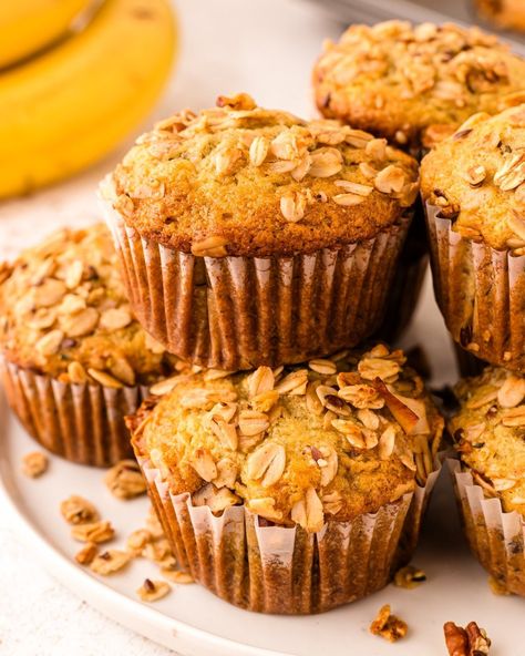 Give your banana muffins a delicious upgrade with this Banana Granola Muffin recipe! The addition of crunchy homemade granola adds texture and a boost of nutrition, while the bananas make these muffins soft and fluffy on the inside and packed with healthy benefits. Comment MUFFINS down below 👇 to have it sent to you! Oatmeal Banana Muffins, Pumpkin Zucchini Muffins, Granola Muffins, Sour Cream Blueberry Muffins, Morning Glory Muffins Recipe, Savory Cupcakes, Pumpkin Zucchini, Blueberry Lemon Scones, Zucchini Muffin Recipes