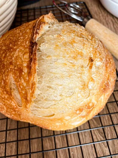 Small loaf of sourdough bread on a black wire rack. Small Sourdough Bread, Sourdough Bread Mini Loaves, Small Sourdough Loaves, Sourdough Mini Loaf, Small Loaf Sourdough Bread, Small Sourdough Loaf Recipe, Small Sourdough Loaf, Small Batch Sourdough Bread, Small Bread Loaf Recipe