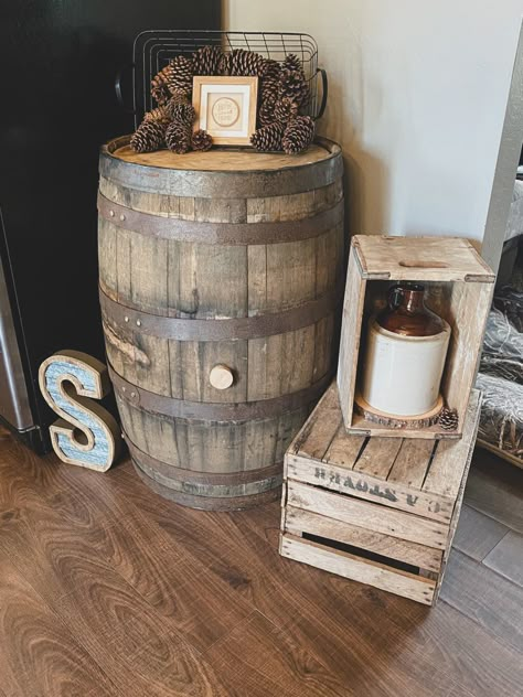 Whiskey Barrel Ideas Indoor, Whiskey Barrel Basement, Whiskey Barrel Home Decor, Wine Barrel Decorations, Antique Whiskey Jug Decor Ideas, Wine Barrel Porch Decor, Repurposed Wine Barrel, Wooden Barrel Decor, Whiskey Barrel Porch Ideas