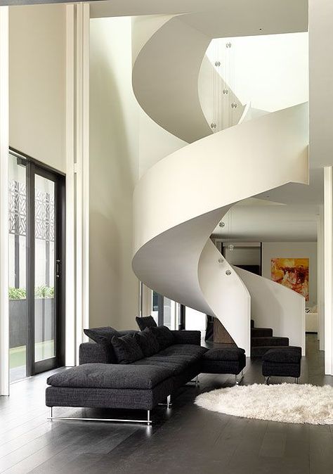 There are curved lines on the stairs of the home, which gives the home a more exotic look. These lines reflect feelings of organization and uniformity. Escalier Design, Flooring Inspiration, Modern Stairs, Interior Stairs, House Stairs, Spiral Staircase, Staircase Design, Stairs Design, Office Building