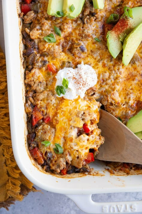 Cheesy Mexican Ground Turkey Taco Casserole with rice, beans, and delicious taco flavors. This easy casserole recipe is so simple to prepare and delicious for the whole family. Ground Turkey Taco Casserole, Turkey Taco Casserole, Taco Casserole With Rice, Casserole With Rice, Ground Turkey Casserole, Ground Turkey Recipes Healthy, Ground Turkey Tacos, Turkey Taco, Turkey Casserole