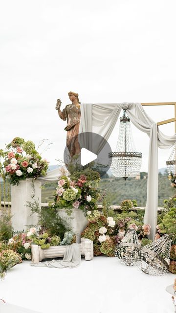 Alessandra Marchetti on Instagram: "✨ A Dream Ceremony in one of the greatest Italian Style Garden ✨
.
We had the absolute honor of designing this breathtaking ceremony, nestled in one of Italy’s most stunning gardens. The focal point? A mesmerizing hexagonal, white-lucid altar adorned with lush floral compositions, flanked by stone statues draped in abundant blooms. Towering flower columns and elegant crystal chandeliers added a touch of timeless luxury, creating a true fairytale setting. 🌿
.
The color palette of soft greens and mauve brought everything to life, adding a natural, romantic vibe. And to make this moment even more unforgettable, we designed a custom 36-meter white-lucid aisle that gracefully curved around the ancient fountain, tying the entire scene together in perfect harm Living Sculpture Sanctuary Wedding, Traditional Ceremony Sets With Motifs, Floral Moongate, White Floral Mandap Decor, Outdoor Hindu Wedding Ceremony, Stone Statues, Wedding Ceremony Decorations, Italian Style, Ceremony Decorations