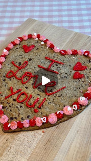 Sam Owen | DIY • Party • Holiday Decor on Instagram: "Easy Heart Shaped Cookie Cake ❤️ 🍪 No special pan needed! This cookie cake is SO EASY and perfect for a Valentine Day dessert! I used a roll of @pillsbury cookie dough. Cut into slices and place into a heart shape, then gently press dough together. Bake according to package. I used my spatula to help shape the sides while the cookie was still hot. Once cooled, add your icing and you’re done! I used @wiltoncakes premade icings. This cookie cake turned out so cute and my kids LOVED it! Definitely give this a try if you’re looking for a quick and easy Valentine’s dessert! . . . #valentines #galentinesday #valentinesday #valentinedessert #easydessert #cookiecake #pillsbury" Heart Shaped Cookie Cake, Pillsbury Cookie Dough, Pillsbury Cookies, Heart Shaped Cookie, Valentine Desserts, Heart Shaped Cookies, Valentines Day Desserts, Simple Valentine, Shaped Cookie