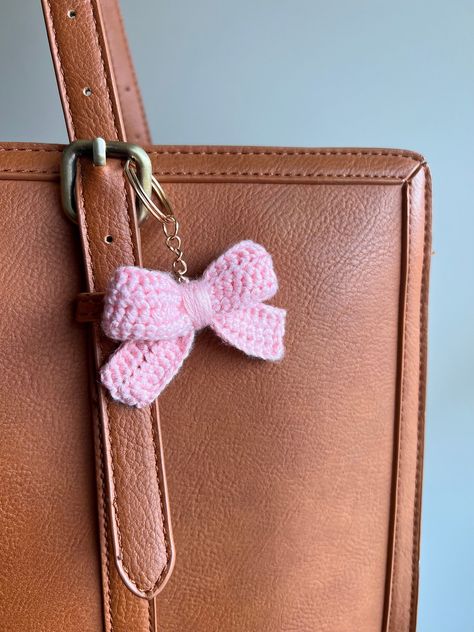 Indulge your romantic side with these charming accessories, ideal for adorning your keys and bags with a whimsical addition. Whether you're strolling through a quaint village or sipping tea in a sun-dappled garden, our Crochet Bow Keychain is the perfect companion for your adventures. Crochet Bow Keychain, Cottagecore Crochet, Bow Keychain, Dappled Sunlight, Crochet Accessory, Crochet Bow, Crochet Pink, Sipping Tea, Free Crochet Bag