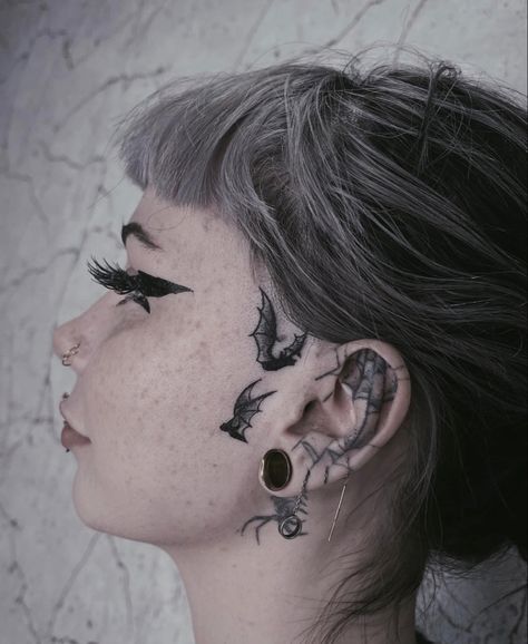 Small Mandala Ear Tattoo, Emo Face Tattoos, Female Sideburn Tattoo, Skeleton Hand On Neck Tattoo, Big Face Tattoo, Cute Side Face Tattoos For Women, Goth Behind Ear Tattoo, Small Feminine Face Tattoo, Goth Chest Piece Tattoo